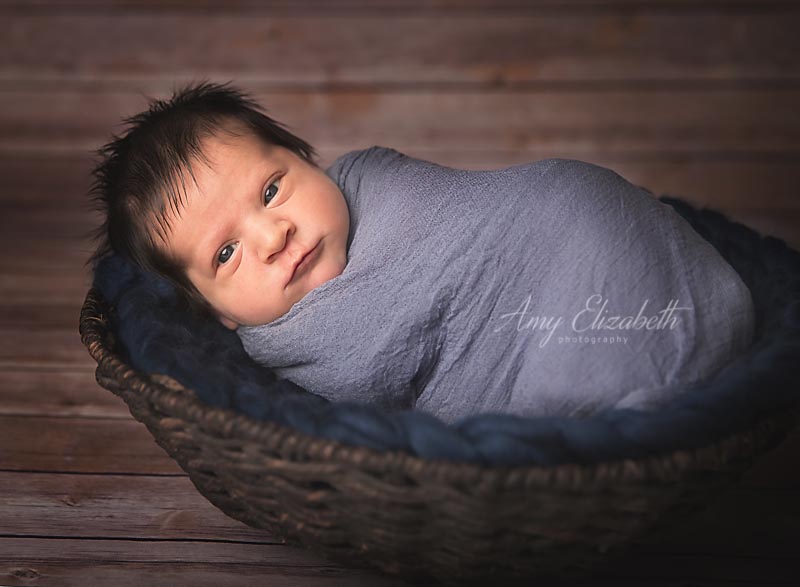 baby boy with dark hair wide awake st. louis newborn photographer - Amy  Elizabeth Photographs