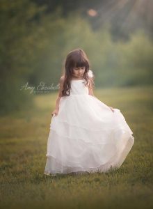 little princess looking at white dress st louis photographers