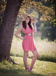 senior girl in coral dress and hat st louis photographers