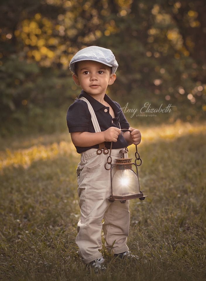 boy in hat with old lantern st louis photographers