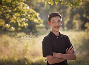 preteen boy with big smile st louis family photographers