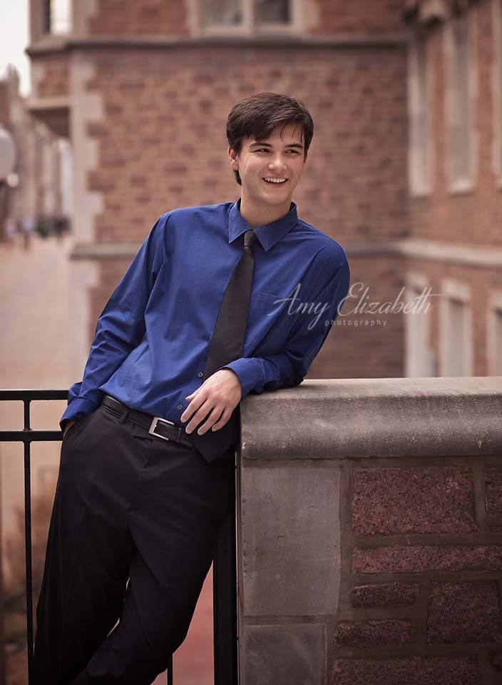 senior smiling in black tie st louis photographer