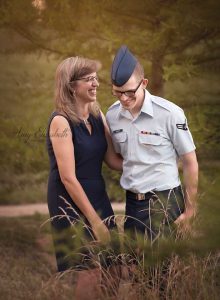 mom laughing with airman son st louis family photographer