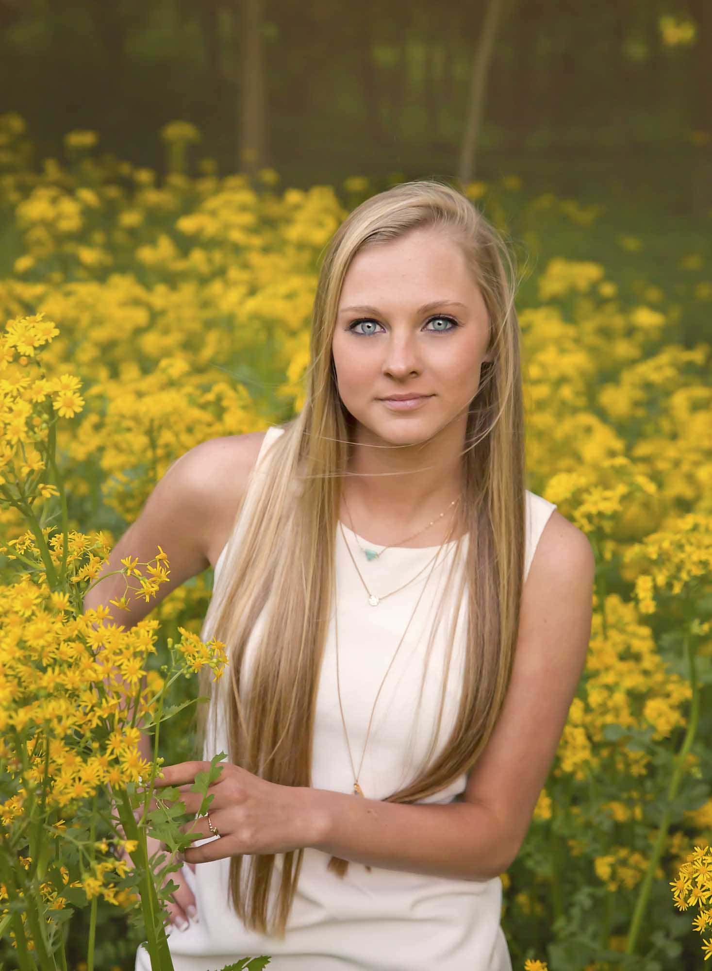 senior girl in yellow flowers st louis photographer