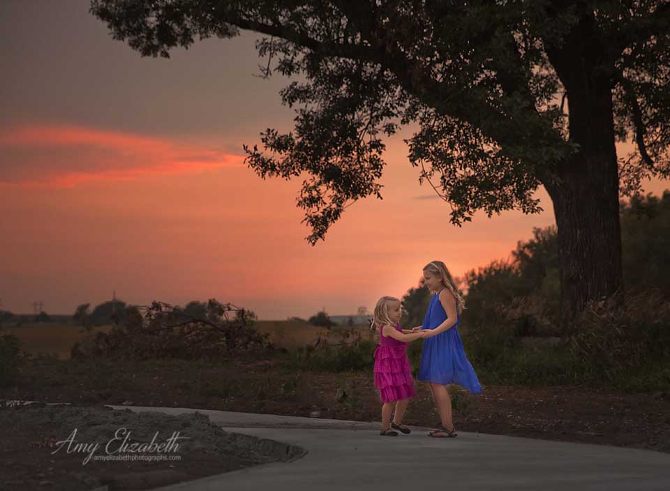sisters dancing at sunset manning iowa
