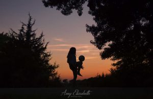 preteen girl with soccer ball silhouette