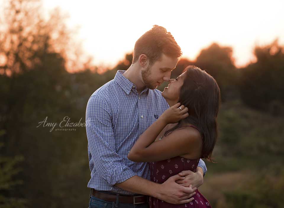 engaged couple with backlight