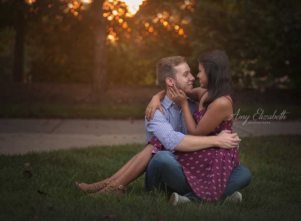 engaged couple in backlight