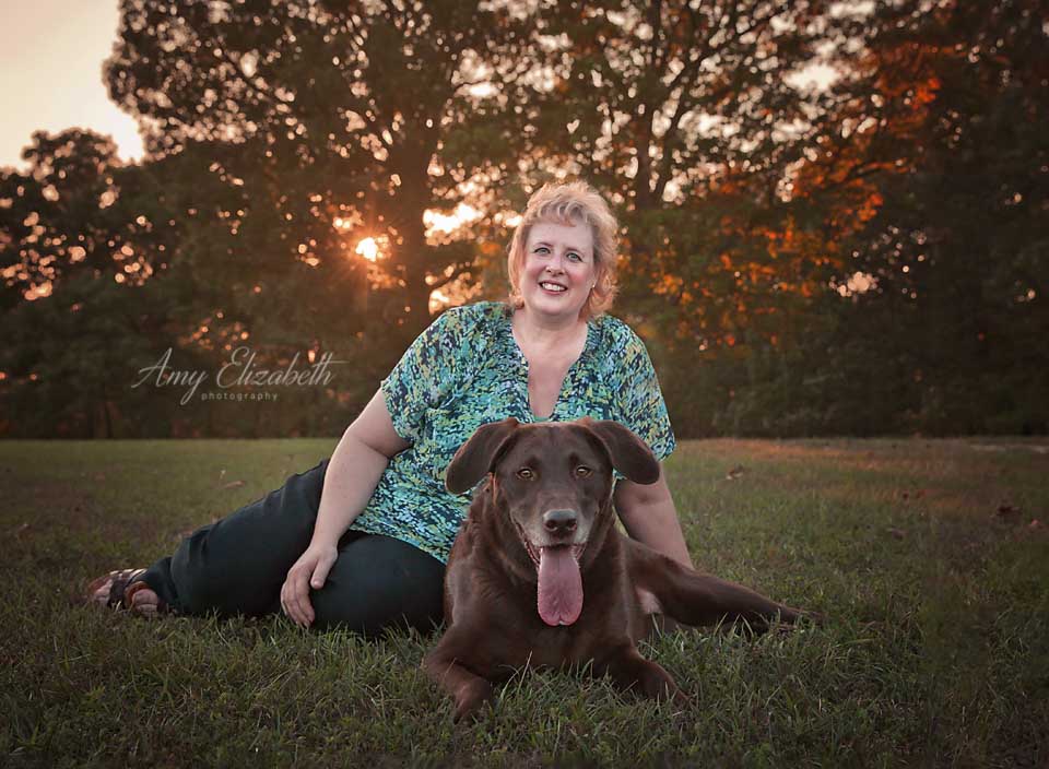 portrait of a woman and her pet dog fall session