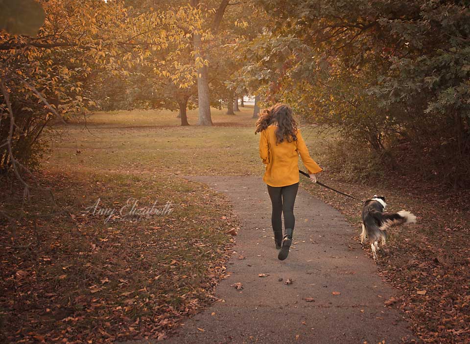 girl running with her dog