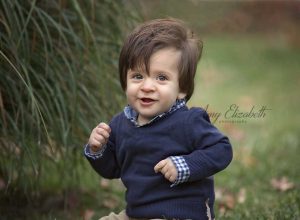 baby boy wearing navy sweater for fall family pictures