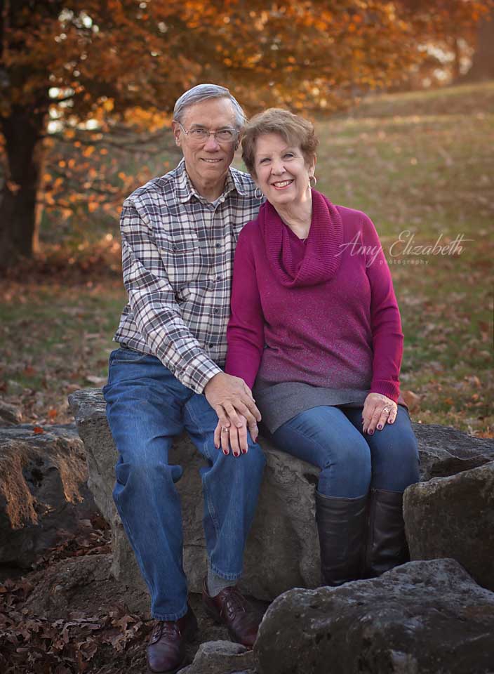 couple sitting on rocks at sylvan springs park