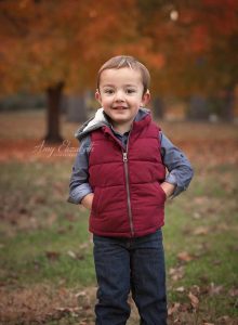 little boy wearing red vest st louis photographer