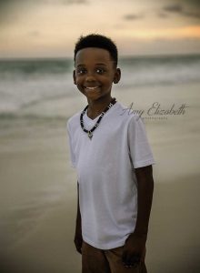 boy in white shirt on beach family photography