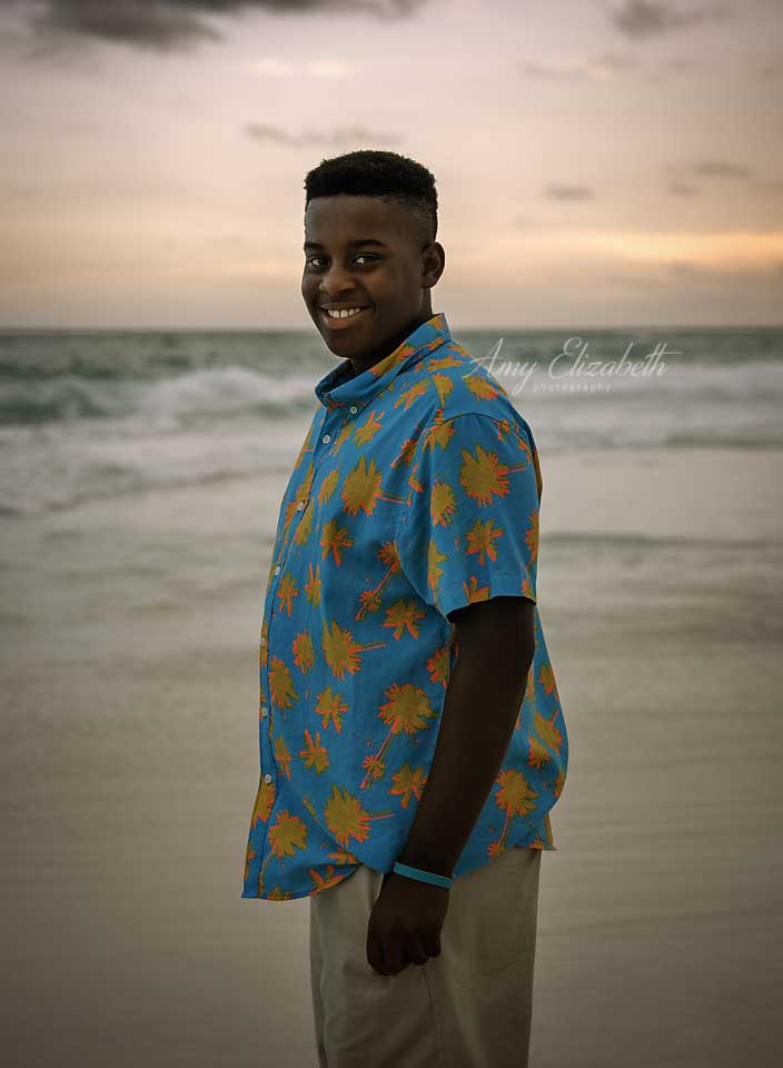 boy in blue shirt on beach st louis photographer