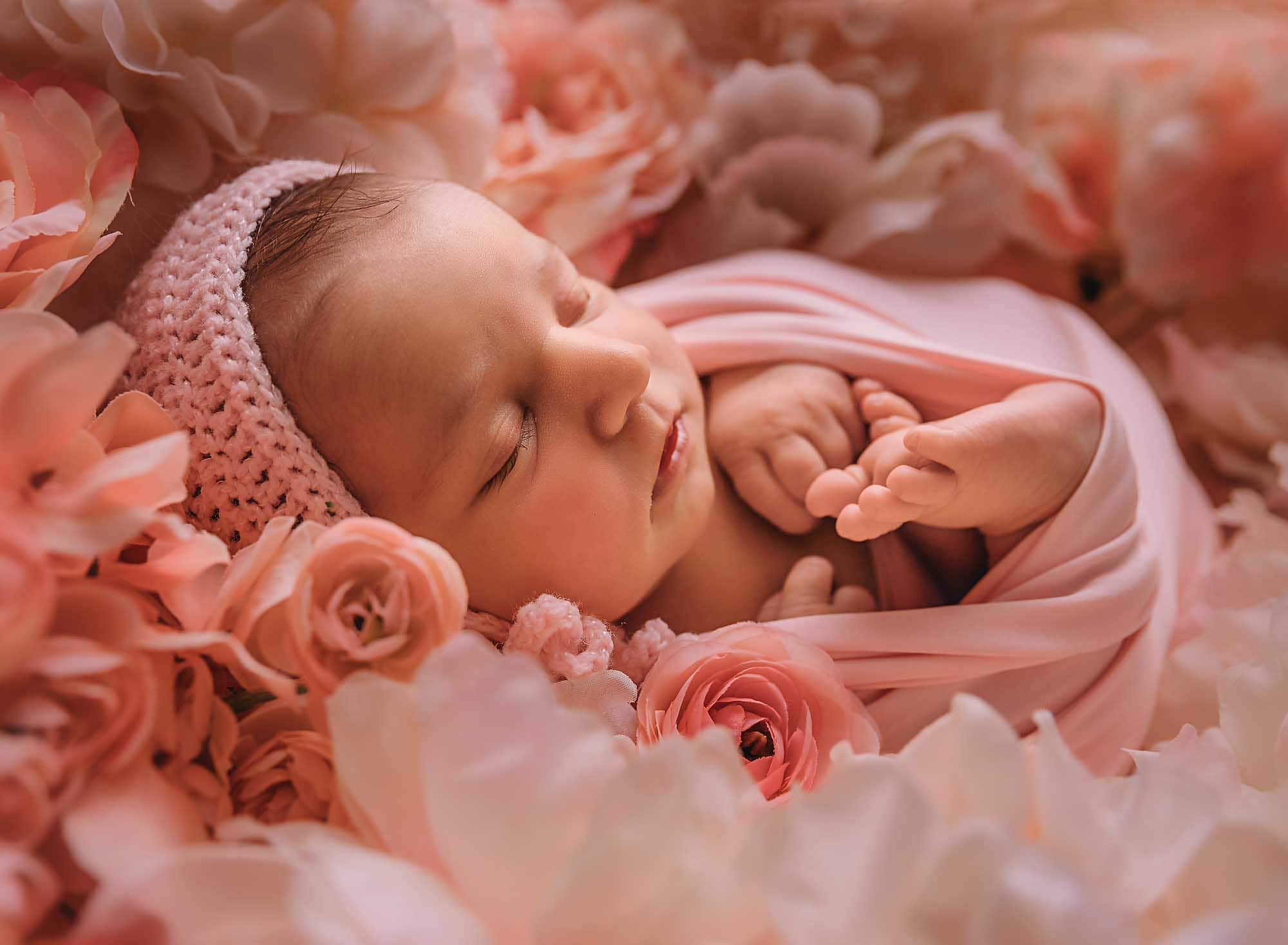 newborn girl in pink flowers
